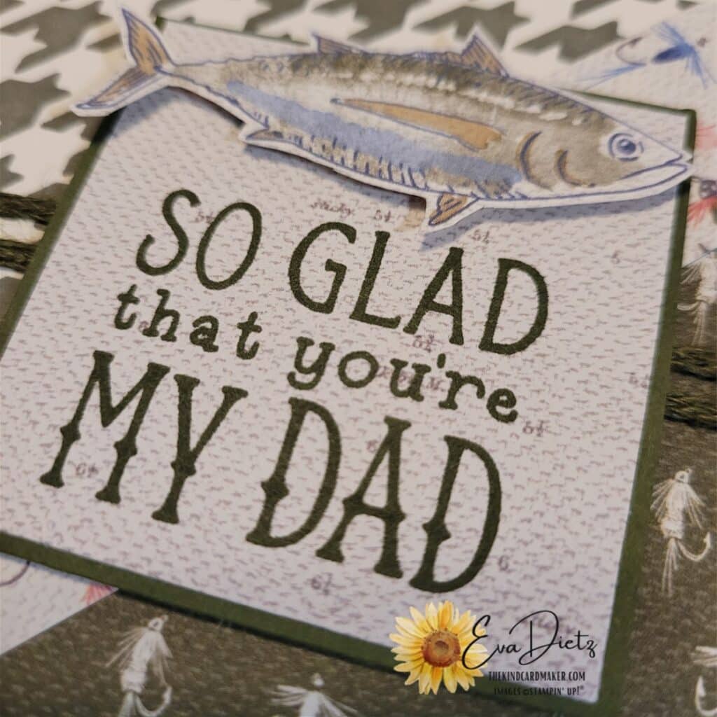 close up photo of the tag on the masculine birthday card that says so glad that you're my dad