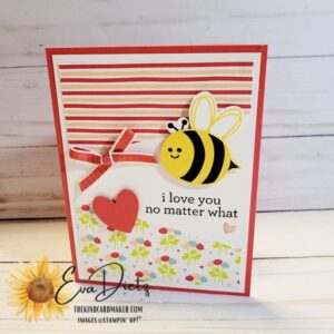 Valentine card that shows a stamped bumblebee, red bow, heart, sentiment on a red card base designed by Eva Dietz, The Kind Card Maker.