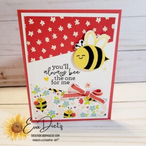 Valentine card that shows a stamped bumblebee, red bow, sentiment on a red card base designed by Eva Dietz, The Kind Card Maker.