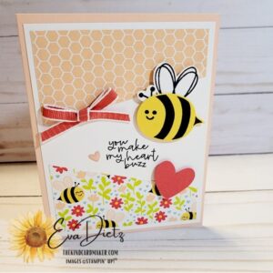 Valentine card that shows a stamped bumblebee, red bow, heart, sentiment on a pink card base designed by Eva Dietz, The Kind Card Maker.