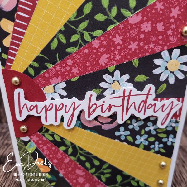 Close up view of handmade sunburst birthday card showing fussy cut sentiment and dimension