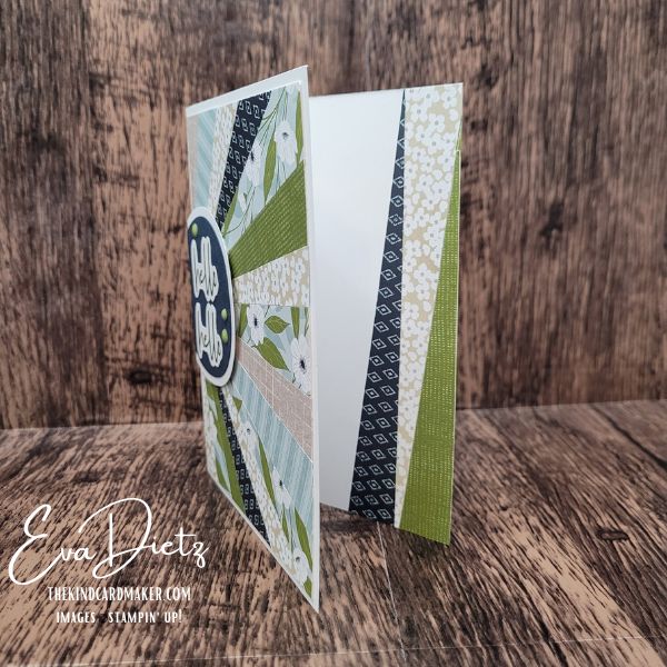 Inside of handmade card with coordinating patterned paper strip and stamped hello sentiment