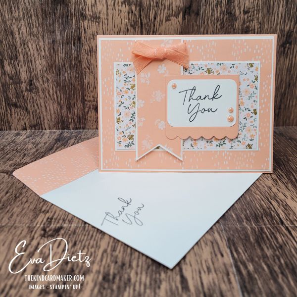 Handmade Thank You card in Crisp Cantaloupe featuring layered designer paper, ribbon bow, and scalloped sentiment tag.