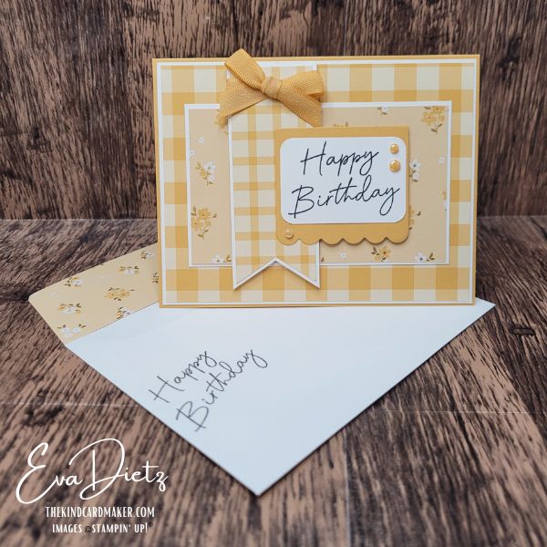 Handmade Happy Birthday card in Golden Glow featuring layered designer paper, ribbon bow, and scalloped sentiment tag.