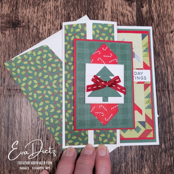 Handmade Pop-Up Pillar Christmas card lying flat beside matching envelope featuring holiday designer paper and Christmas tree focal point.
